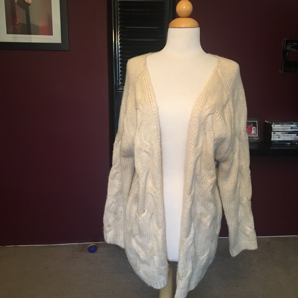 Cream colored knit cardigan size M by 36 point 5